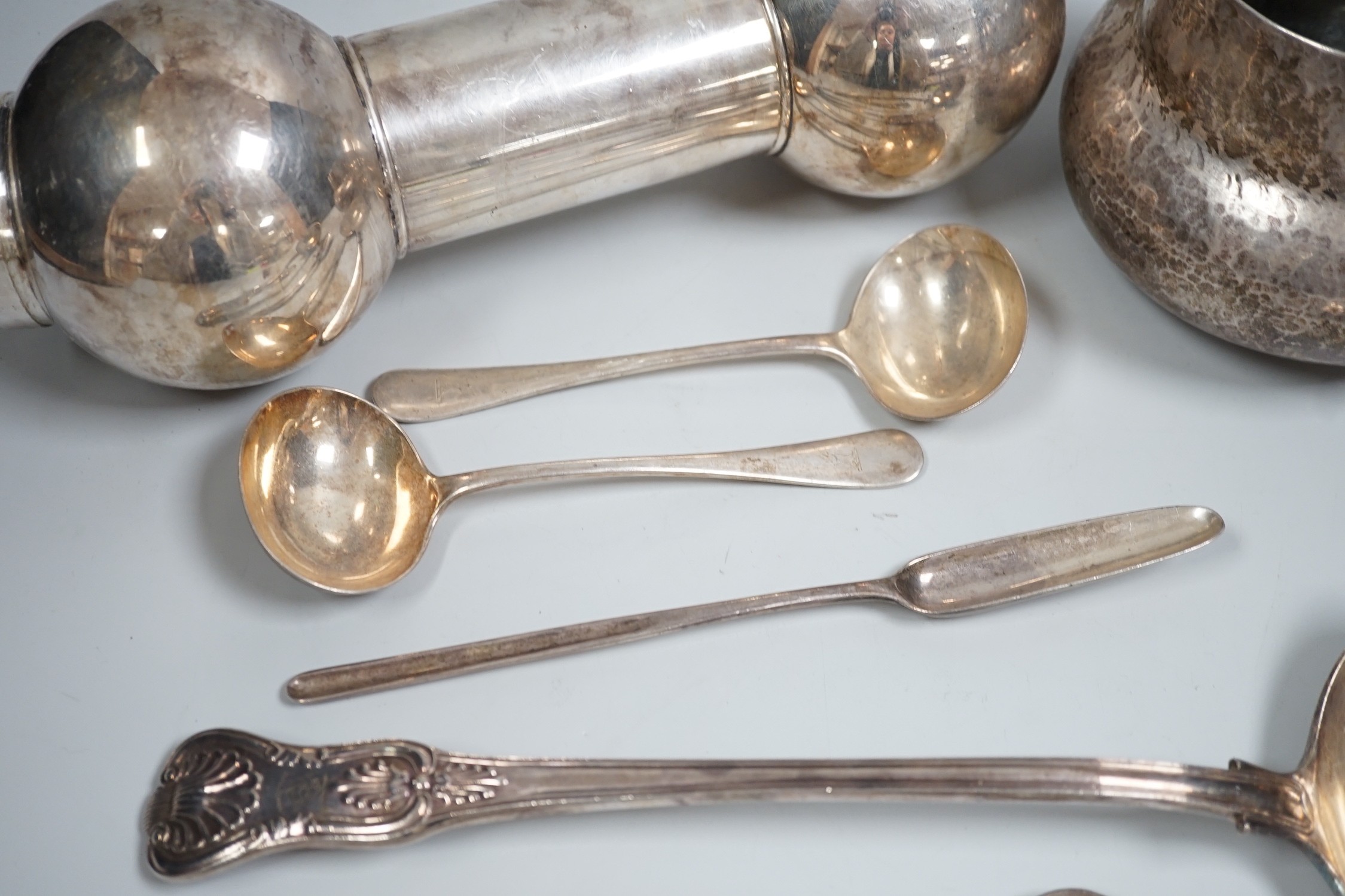 Mixed silver and plated ware including a Victorian silver Kings pattern soup ladle, London, 1857, a George III silver marrow scoop, London, 1789, a pair of later Old English pattern sauce ladles, a sterling bonbon dish,